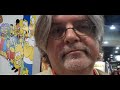 Hear what the SIMPSONS creator thinks about Comic-Con (which he has attended since 1977) getting larger and larger each year. Stay tuned at the end to see him shake hands with Spider-Man Yarmulke Guy.