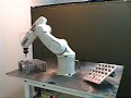 Adept Viper robot placing pegs on angled board