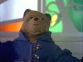 Paddington Bear sings in the rain