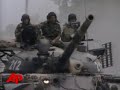 A Georgian minister says Georgian troops have pulled out of the capital of the breakaway province of South Ossetia under massive Russian shelling. (Aug. 10)