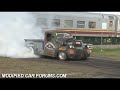 www.modifiedcarforums.com Dennis Maloney gets a jump start from the Jucy camper before burning the tyres off of his blown ratrod at Ingham Car and Bike Show 2009 Check out the train going past during the burnout, train tracks go right through the middle of this event.