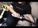 Amos Playing Guitar Hero Using 2 Guitars