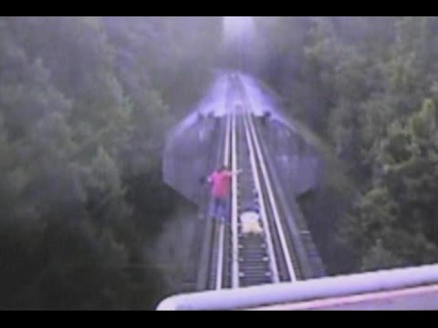 Women on Train Tracks Narrowly Escape Getting Hit
