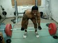 me attempting a 457 lb deadlift. if you can't tell my left hand grip strength sucks.