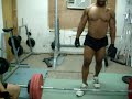me attempting a 457 lb deadlift. if you can't tell my left hand grip strength sucks.