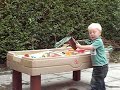 Jack plays in Sandpit