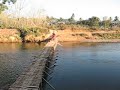 Crossing a bridge in Laos