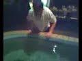 Kid dunks head in Fish pond
