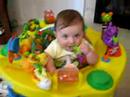 Kylie Eating Keys In Exersaucer