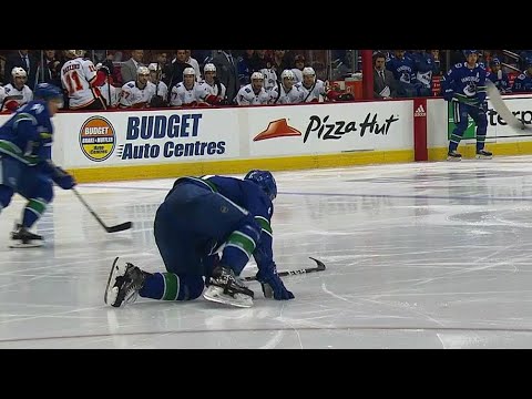 Video: Boeser crawls & scrambles to bench after blocking hard shot with foot