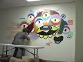 Chase paints mural at DG Chase paints mural at DG