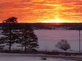 Winter sunrise over a frozen L'Anse Bay which is the lower end of Keweenaw Bay which is on Lake Superior. You are looking from the town of Baraga to L'Anse. You should be able to see some ice fishing tents too.