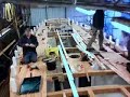 Laying the deck on a traditional wooden boat