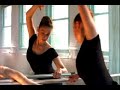 Ballerina stretching on barre