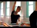 Ballerina stretching on barre