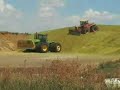 Graankuil aanrijden met John Deere en Versatile