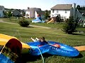 my friend trying to go down a water slide