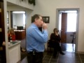kevin smith playing his harmonica at the annual smith insurance christmas party!