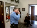 kevin smith playing his harmonica at the annual smith insurance christmas party!