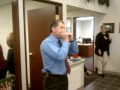 kevin smith playing his harmonica at the annual smith insurance christmas party!
