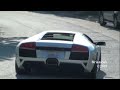 BrianZuk records hundreds of supercars departing from Concorso Italiano 2009. Video shows many of the cars accelerating, and revving as well. Here is a list of the exotics that were present, many, multiple of each: Lamborghini: - Gallardo LP550-2 Valentino Balboni - LP560-4 - Murcielago LP640 Versace Roadster & LP640 Coupe - Murcielago Roadster & Coupe and 50th Anniversary - Gallardo Spyder & Coupe - Superleggera - Diablo VT 6.0 SV & Roadster - Countach - Miura Ferrari: - Enzo - F40 - 430 Scuderia - 599 GTB Fiorano - 612 Scaglietti - Challenge Stradale & 360 Modena & 360 Spider - F430 Coupe & Spyder - 575 SuperAmerica & 550/575 Maranello - F355 Coupe & Spider & 348 - 512 Testarossa - 288 GTO Others: - Mosler MT900 GTR - Alfa Romeo 8C Competizione - Lotus Elise & Exige - Aston Martin Vantage Roadster - Porsche 997 GT3 RS & GT2 & Turbo - Maserati Granturismo & Gransport - Rolls Royce Phantom Drophead - Dodge Viper ACR & SRT/10 - Audi R8 - BMW M5 - SV 9 Competizione - Tesla Roadster Sport & Model S