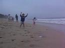 garrett and taylor playing on the beach at half moon bay while enjoying a visit from their uncle pete