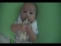 Elijah holds his bottle