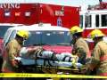 2009-05-12 03 Irving Texas Fire Department: last victim moves hands on way to ambulance