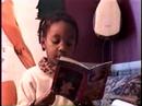 My daughter \"reads\" the Gingerbread Man book. My daughter \"reads\" the Gingerbread Man book.