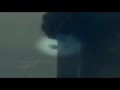 explosions can be seen coming from lower floors of WTC