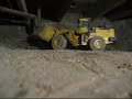 Komatsu WA 500 tidying up in the Crawl Space