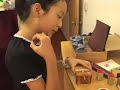 Jin Yiyi shows buster how to make Chinese stamps