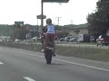 Wheelie on Motorcycle- Tandem Stunt