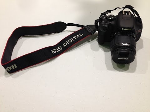 how to attach neck strap to camera
