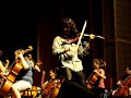 mark wood performs with the st. charles high school orchestra in st. charles, mo on september 8, 2007 at st. charles west high school. a power outage caused a last minute change of venue, but mark, the orchestra and the sound technicians from mozingo music rose to the challenge and the show went on . . . awesomely!