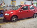 Chevrolet aveo induccion=escape