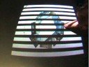 Creating a multi-touch, bare finger, touchable surface by leveraging the invisible dynamic structure in the light cast by rasterizing, laser-based micro-projector. This work was intended to bring touch surface interfaces to next generation cell phones that will have cameras and micro-projectors with no additional hardware. While being low-cost we also needed a technique that would work in challenging environments like bars and dorm rooms where off-the-shelf computer vision algorithms would fail. Unfortunately the Mitsubishi Electric cellphone division was cut in 2008. Work done in 2007 and 2008. Presented at IEEE Tabletop in October 2008. Paul A. Beardsley, Yuri A. Ivanov, Biliana Kaneva, Shoji Tanaka, and Christopher R. Wren with special thanks to Chia Shen, Clifton Forlines, Daniel Wigdor for sharing their surface interaction expertise, to John Barnwell for running the Hardware Lab, and to William Yerazunis for making sure we didn't burn the place to the ground.
