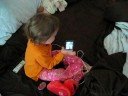 Charlotte demonstrates how to use an iPod
