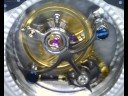 Short video of my Flying Tourbillon Regulateur watch movement using a digital video microscope. Video is taken at about 38x which is as close as I could get keeping the whole escapement in the shot. The circular hole in the face of the watch is 13mm across and the balance wheel is about 7mm across as a point of reference.  Completes one 360 degree rotation every 60 seconds.