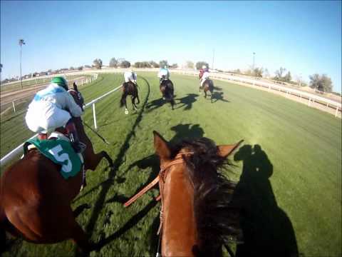 jockey - Phoenix, AZ - March 27th 2011 Turf Paradise Race 8 going 7 1/2 furlongs on the Turf. This POV HD helmet cam footage gives you a captivating and/or fascinatin...