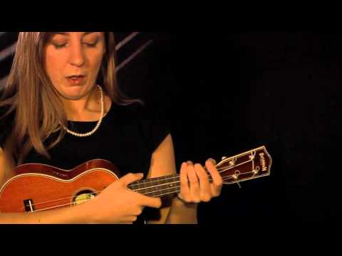 how to hold a ukulele properly