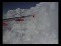 thunderstorm clouds over the alps on the beautifully smooth easy jet flight from nice to geneva on july 17, 2004. the second part shows the beginning of the descent, flying around nice looking cbs.