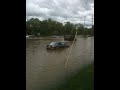 Kutztown area Mennonites teach a Kutztown University student the proper method for fording a flooded road. Tuition well spent!