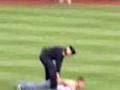 Benches clear, fan runs onto field.