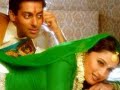 Song: Maye Ni Maye (Full Song) Singer: Lata Mangeshkar Movie: Hum Aapke Hain Kaun (1994) Starring: Salman Khan, Madhuri Dixit ___________________ LYRICS (+ Translation) ___________________ maaye nin maaye munder pe teri bol rahaa hai kaaga Mother, mother, on your parapet a crow is cawing: johan ho gayi teri dulaari Your darling daughter has become a devotee, man jogi sang laagaa she has fallen in love with an ascetic. chhan maahitaa chhan maahiya The sizzling of fireworks; mere dhol sipaahiyaan o my drumer chaand ki tarah chamak rahi thi us jogi ki kaaya The yogi's appearance was sparkling like the moon. mere dwaare aakar usne Entering my gates, he pyaar ka alakh jagaayaa asked alms in the name of the god of love. apne tan pe bhasm ramaa ke Rubbing ashes on his body, saari rain voh jaagaa he stayed awake the whole night (outside my door). jogin ho gayi teri dulaari Your darling daughter has become a devotee, man jogi sang laagaa in love with a yogi. sun hiriye nach hiriye Listen, lovely, dance, lovely, nach ke rang jamaa dance and lend color to the assembly. sun hiriye nach hiriye Listen, lovely, dance, lovely, nach ke dhuum machaa dance and create an uproar. matrat maangi thi tu ne is roz You prayed that, one day, main jaayuun bihaayi I would get married. us jogi ke sang meri tu kar de ab kudamaayi Would you now please celebrate my engagement to that yogi? in haathon mein lagaa de meinhadi Put henna on these hands baandh shagun ka dhaagaa Tie the thread of marriage <b>...</b>