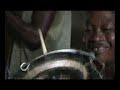 http://www.refugeeallstars.org - sierra leone's refugee all stars improvise a high-hat in sembakounya refugee camp. the sequence shows reuben m. koroma, the band's leader, making the cymbal from an old hub cap and old bicycle spokes. clip taken from award winning documentary 