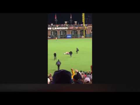 Giants' Angel Pagan Tackles Fan Handing Out Flowers During Dodgers Game