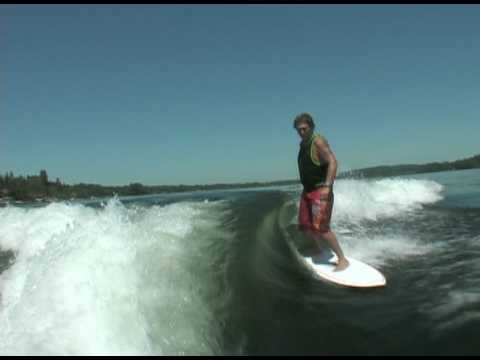 Jeff riding behind a Centurion on Inland Surfer Squirt board