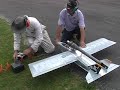 After a few delays and some last-minute changes to the fuel system so that the engine could draw fuel up the 8-inches between the tank-bottom and the spraybar, the first flight of the pulsejet-powered World Models tamecat has happened. It's sure not lacking in power (10lbs thrust versus 7lbs flying weight) and it was damned fast! Despite being a mild-mannered pussy-cat when powered by a regular glow-engine it's very apparent that under full jet-thrust I'm going to have to cut back the elevator throw a little. The tamecat is such a big pussy to fly once the power's off though - landing is a breeze! The engine switched to lean-mode short-cycling when I pulled high-G's in the second turn so I'll have ti increase the fuel pressure some more and reduce the size of the fuel-metering jet so as to reduce the effect of hi-G's on fuel-flow. With luck, I'll get the changes done and fly it again tomorrow! Don't miss that video -- subscribe now. And if you like what you see, tell World Models that they should offer a pulse-jet version with a few modifications. I'll let them have the necessary changes. This is the *perfect* pulsejet trainer!