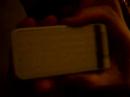 Takesako showes his cell phone with Plagger logo